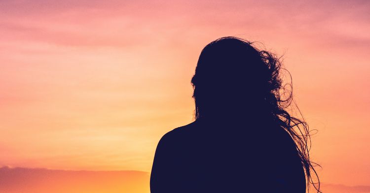 A woman's silhouette against a life-changing sunset.
