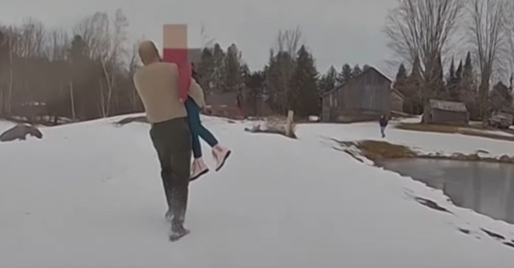 A state trooper helps rescue a little girl from a frozen pond.