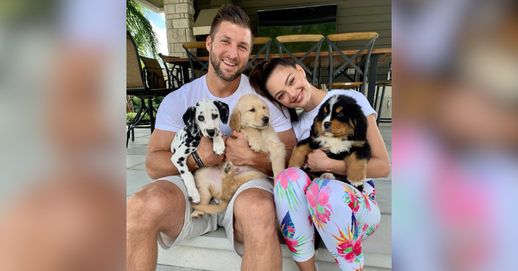 tim tebow and puppies
