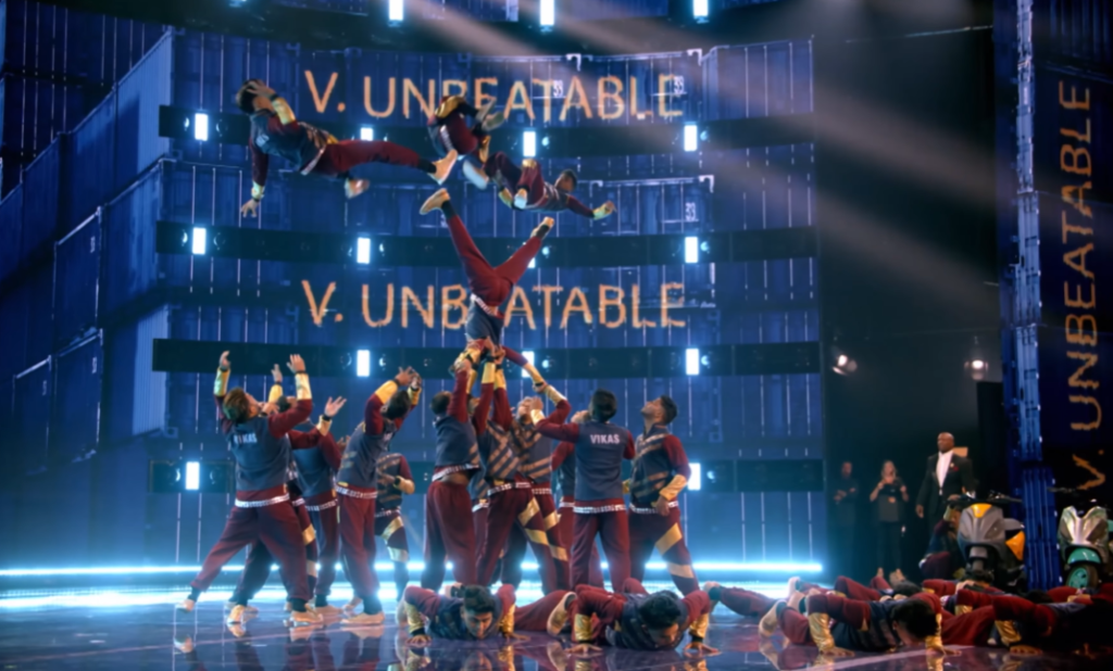 Dance group V.Unbeatable performs on "America's Got Talent: Fantasy League." A number of members guddle together to catch the three who are mid air. 