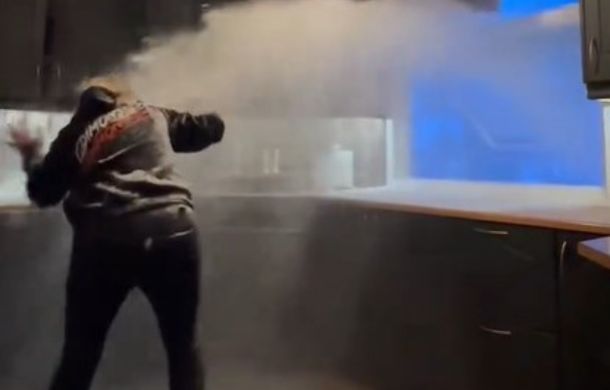 As snow cascades into her once-clean kitchen, a Norwegian housewife fights against the pressurized blast to try to close the open window.
