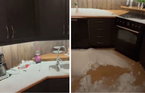 Snow covers everything in the once-clean kitchen.