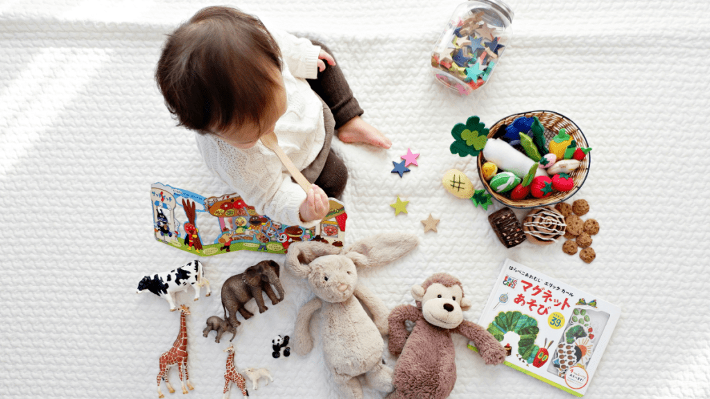 baby surrounded by toys