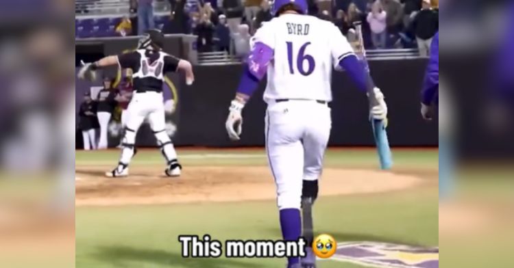 Parker Byrd walks onto the baseball field with his prosthetic leg.