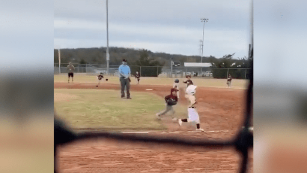 boys running at baseball game