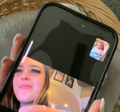 View of a phone as Ashley Nicole FaceTime's her sister to show off her baby she had from a cryptic pregnancy.