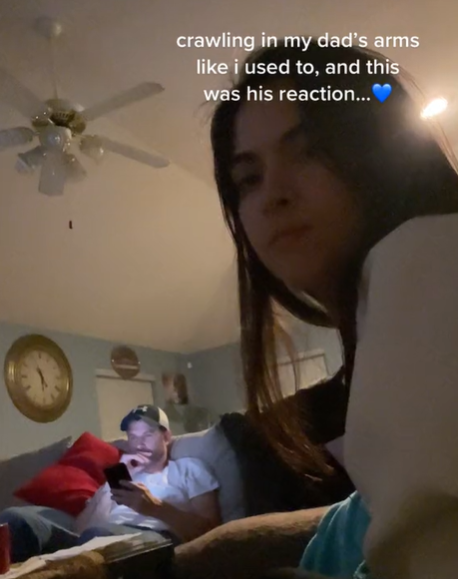 A dad and daughter in the living room of their home.