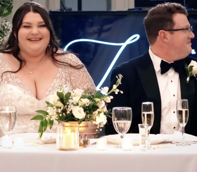 excited bride sitting next to the groom