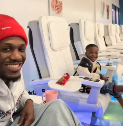 A father and son go the nail salon together and get mani-pedis.