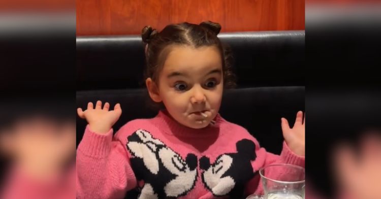 A little girl tries different foods in Japan.