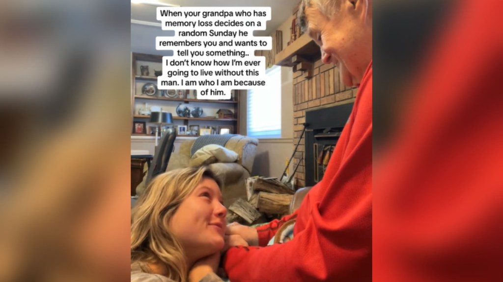 A young woman rests her head on her grandpa's lap as they hold hands. He smiles down at her. Text on the image reads: When your grandpa who has memory loss decides on a random Sunday he remembers you and wants to tell you something. I don't know how I'm ever going to live without this man. I am who I am because of him.