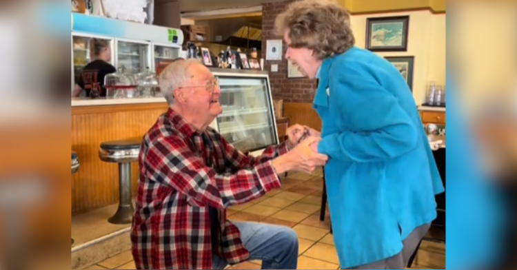 An elderly widower gets down on one knee to propose to his girlfriend.