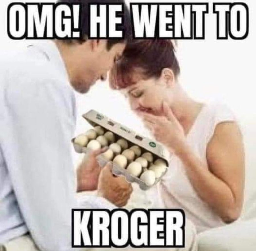 A man presents a carton of eggs to a happy woman.