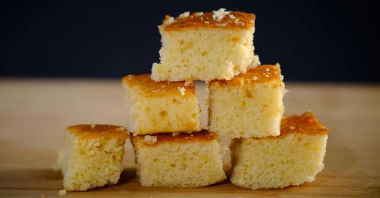 Pieces of cornbread stacked together in a triangle.