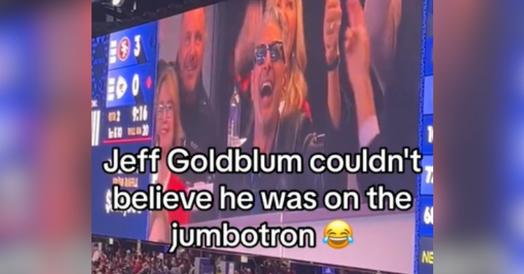 Jeff Goldblum looks happily shocked as he's shown the jumbotron at the Super Bowl.
