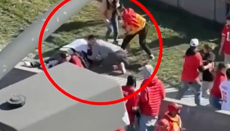 Screenshot from footage of Trey and Casey during the shooting at the Kansas City Parade. A red circle on the image shows the couple tackling the shooter.