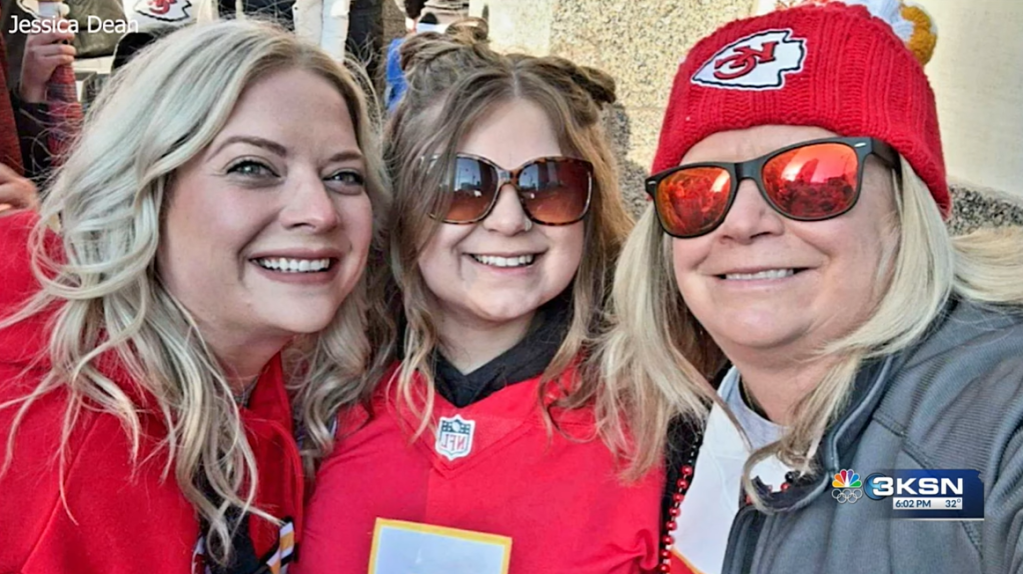Selfie with Jessica Dean smiling with two people in her family. They're wearing Kansas City Chiefs merch.