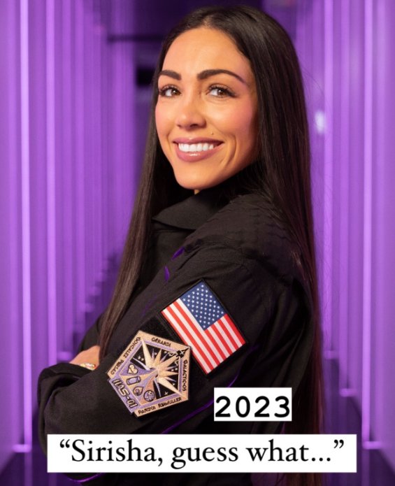 Kellie Gerardi posing in her uniform after becoming an astronaut.