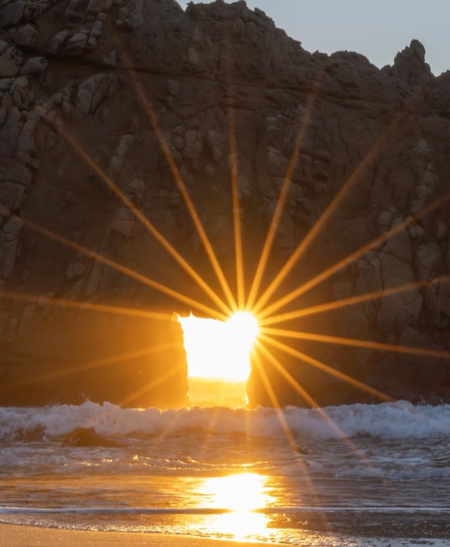 A gorgeous phenomenon where the sunset lines up with the keyhole in a natural arch.