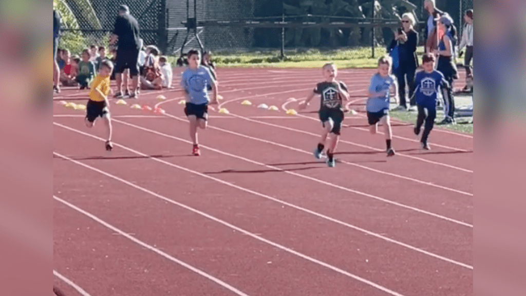 kid running on track