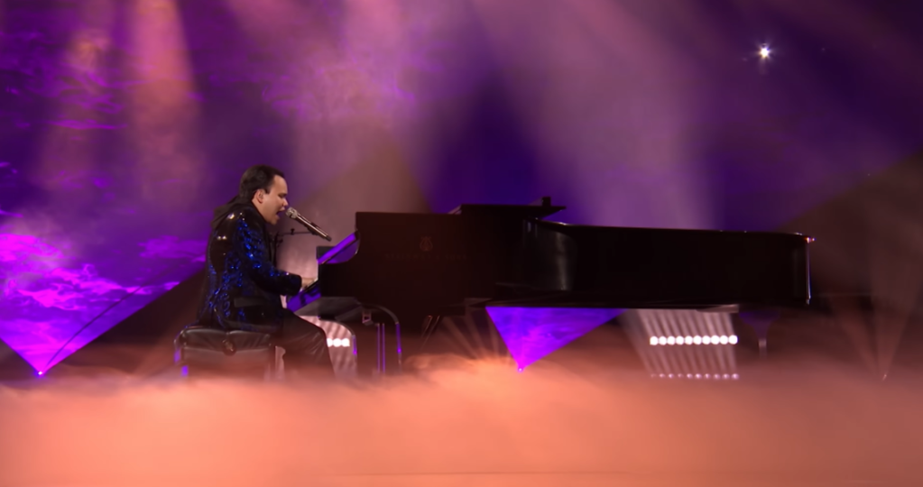 Kodi Lee sits at a piano on "AGT: Fantasy League" and sings "Bohemian Rhapsody" by Queen.