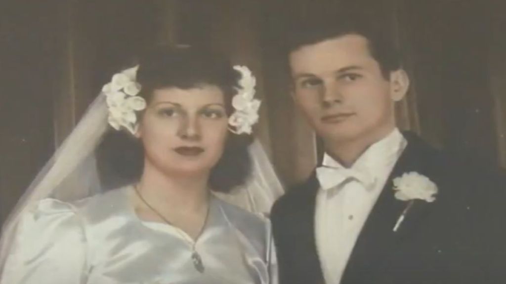 A vintage photo of a couple on their wedding day.