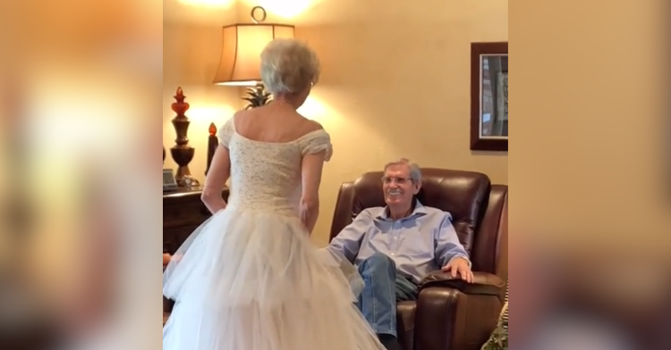 man looking at woman in wedding dress