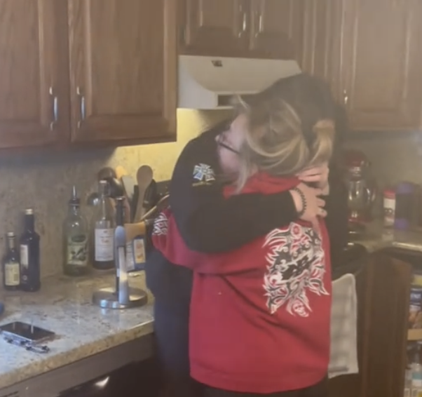 mom hugs daughter