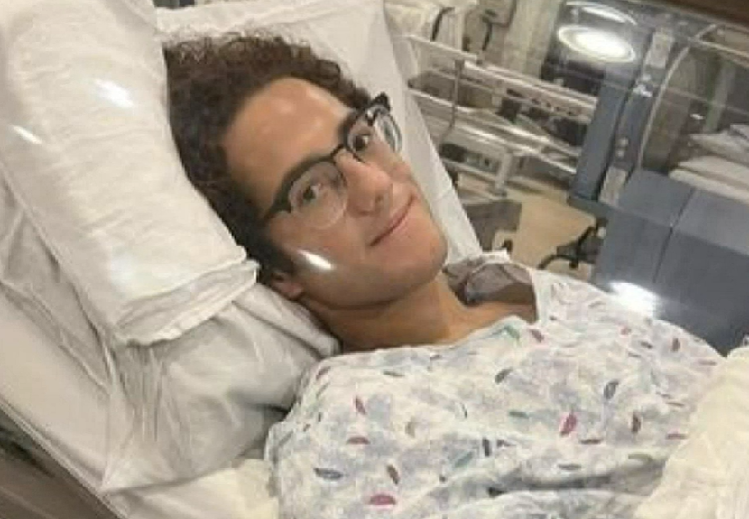 Parker Byrd lays down on a hospital bed after his boat injury.