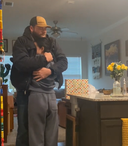 A man hugs his wife after finding out she's pregnant despite infertility issues.