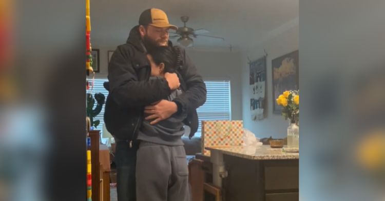 A man hugs his wife after finding out she's pregnant despite infertility issues.