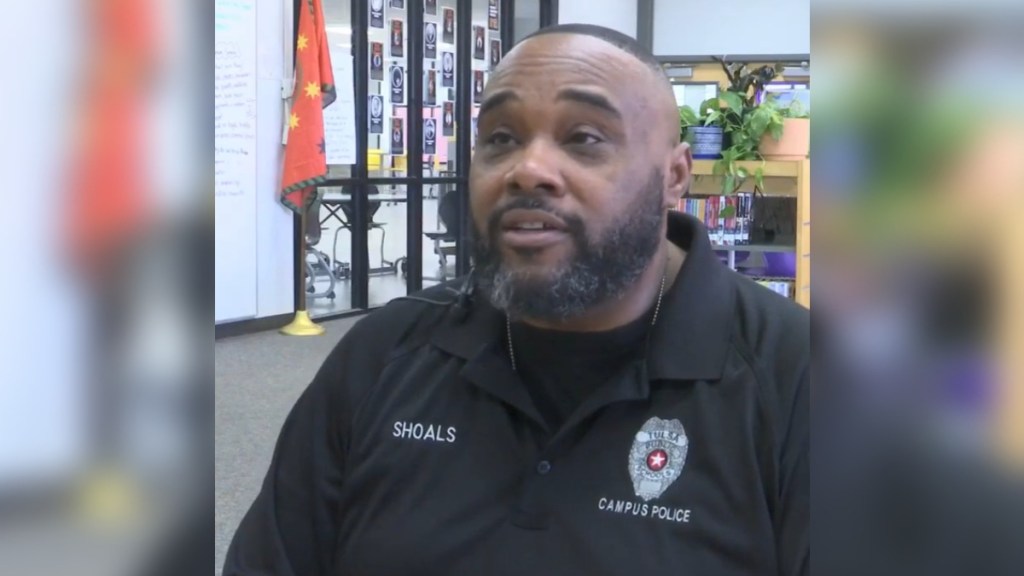 Lyndell Shoals sits in a classroom as he chats with local news.