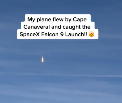 View from a plane of a SpaceX rocket in the air. Text on the image reads: My plane flew by Cape Canaveral and caught the SpaceX Flacon 9 launch!!