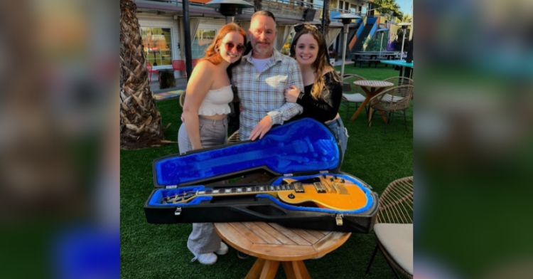 Two daughters reunite their dad with his precious stolen guitar.