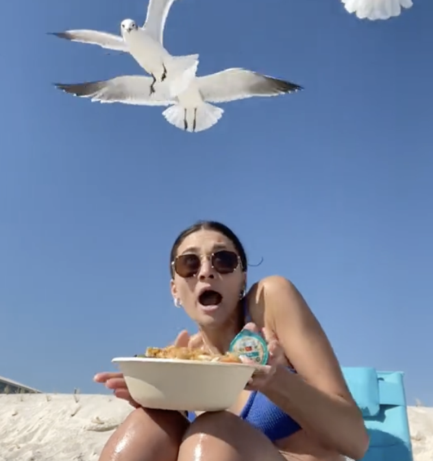 woman gets swarmed by hungry seagulls