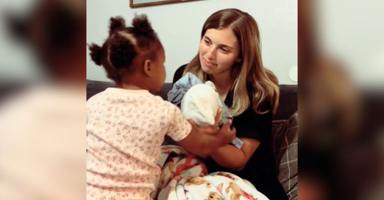 A toddler spends time with her foster mom and sibling.