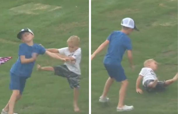 As the fight between the brothers continues, the younger boy leads with a karate-style kick, only to be tossed aside by his big brother.