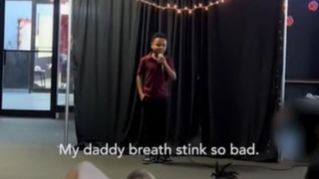 Young comedian at a school talent show beginning his routine. "My daddy breath stink so bad..."