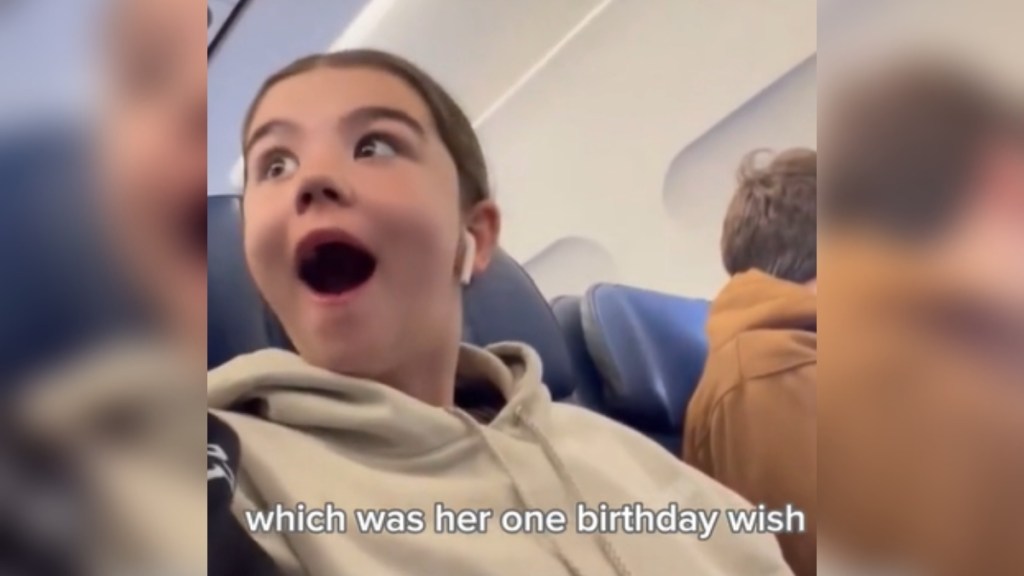 A little girl looks over at someone, eyes wide and mouth open from excited shock. Text on the image reads: which was her one birthday wish