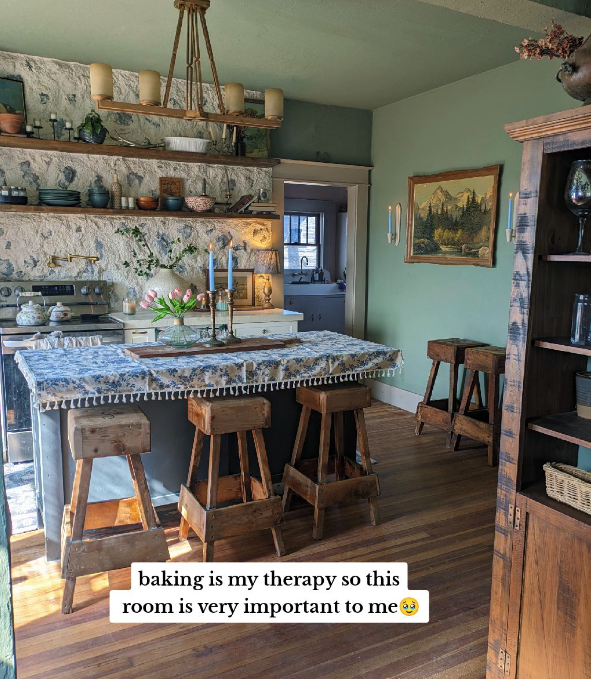 A beautifully decorated room with an oven and a table.