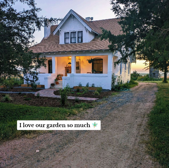A renovated home with white walls and a front porch.