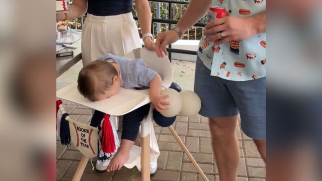 A baby face-plants into the tray table on his first birthday.