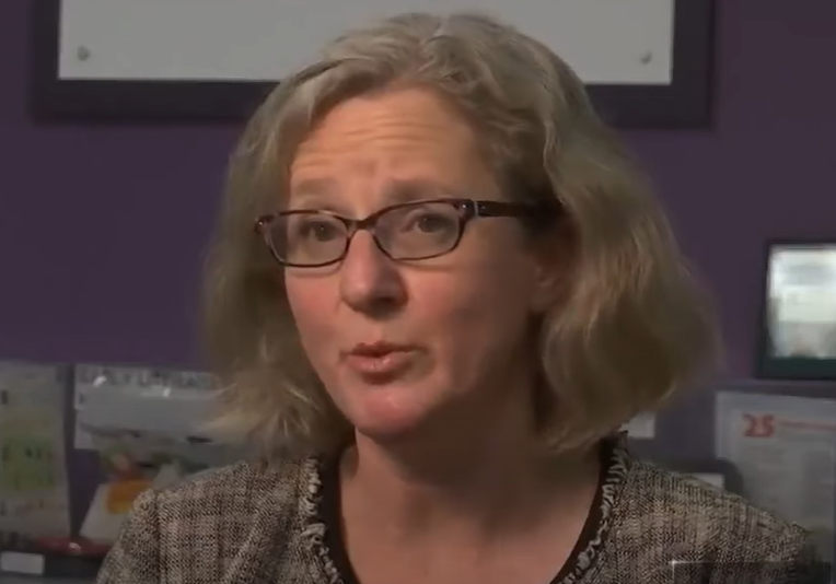 Close up of Maria Daane speaking with local news.