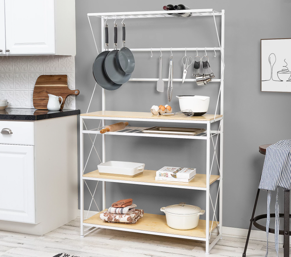 An organized kitchen with a white baker's rack.
