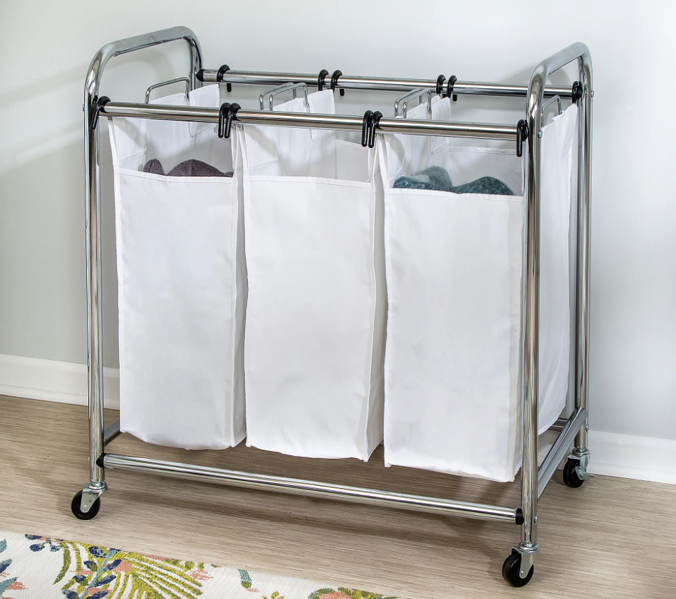 A white laundry hamper with three different sections.