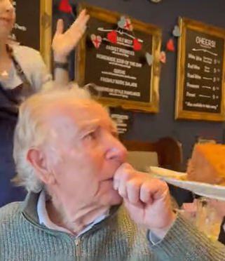 A grandpa is overcome with emotion on his birthday.
