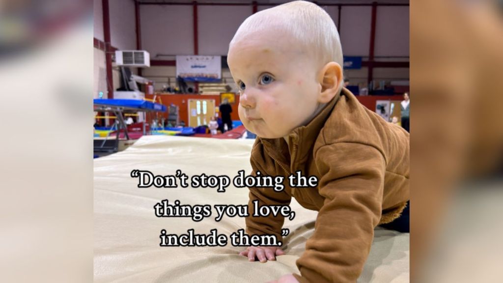 A quote on parenting over an image of a baby on all fours.