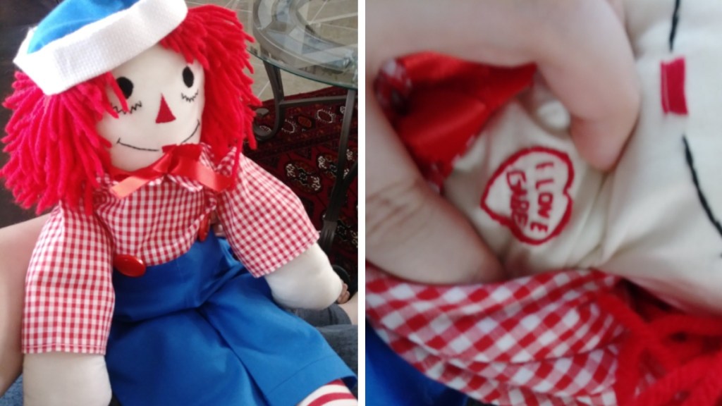 A two-photo collage. The first shows an altered Raggedy Ann doll sits on Gabe's lap. The second image shows a close up of that same doll. A stitched heart surrounds words that say: I love Gabe.
