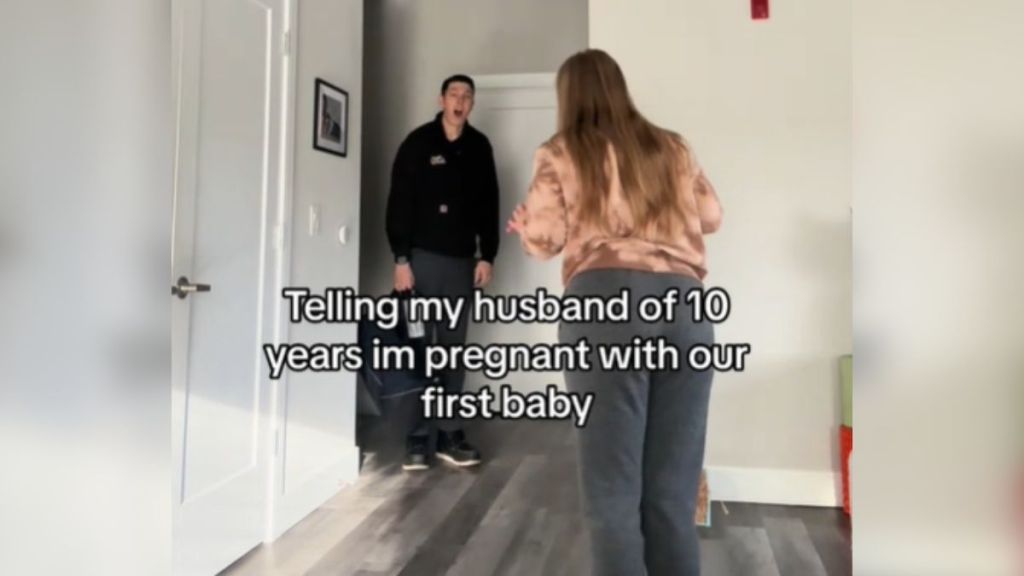 A man looks surprised when his wife reveals that she's pregnant with their first baby.