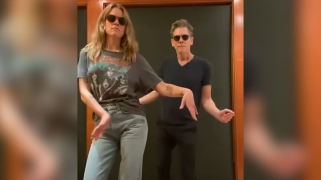 Actor Kevin Bacon does a silly dance with his daughter.